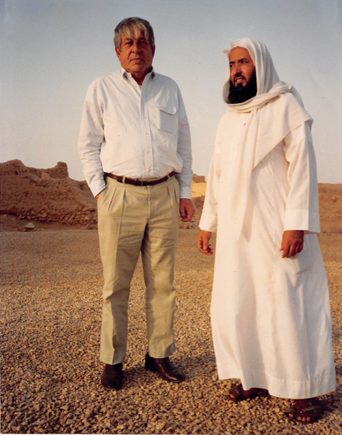 Photo of Walter Ferro in collared shirt and pants next to man in middle eastern garb